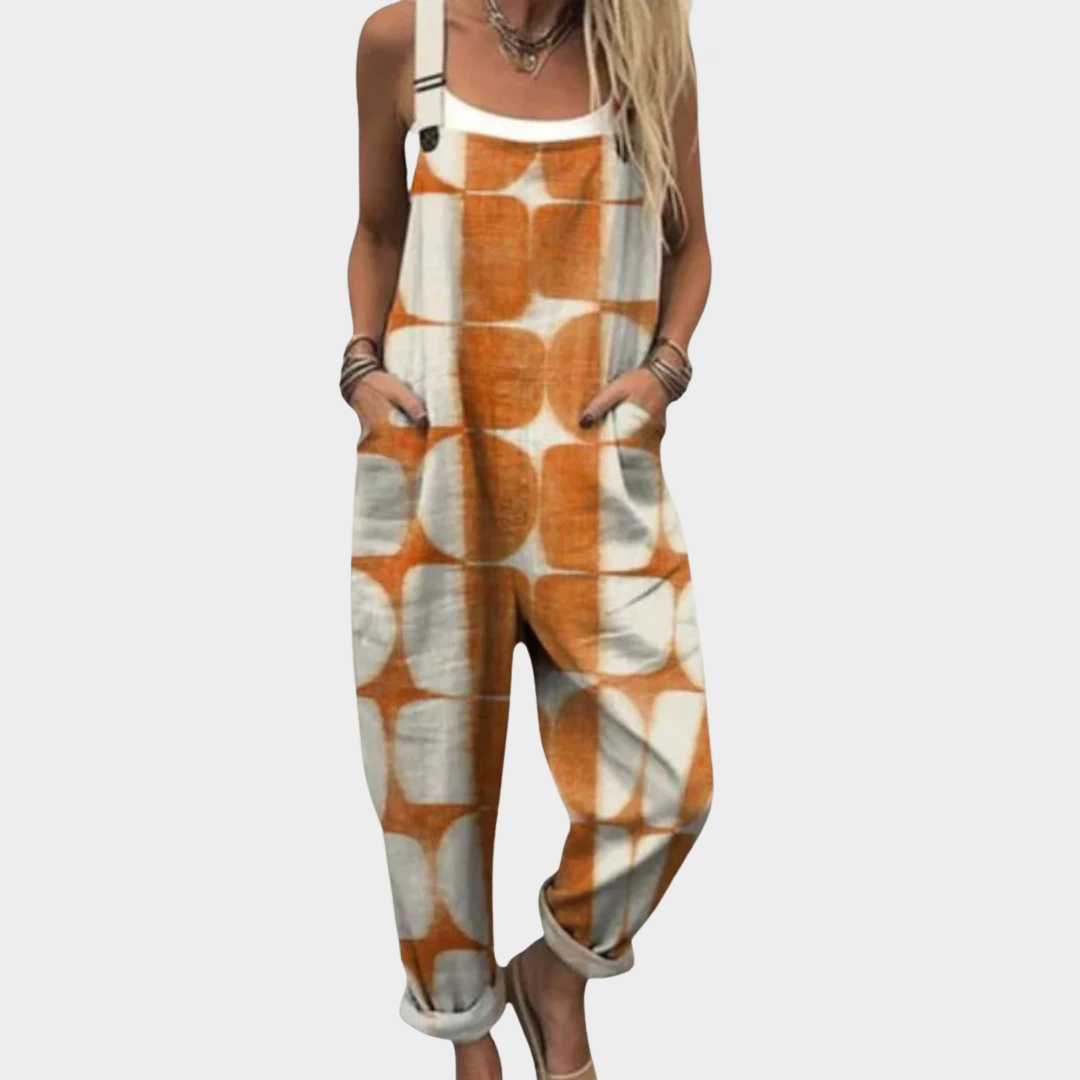 Woman wearing cream overalls with a graphic orange geometric circle and square pattern