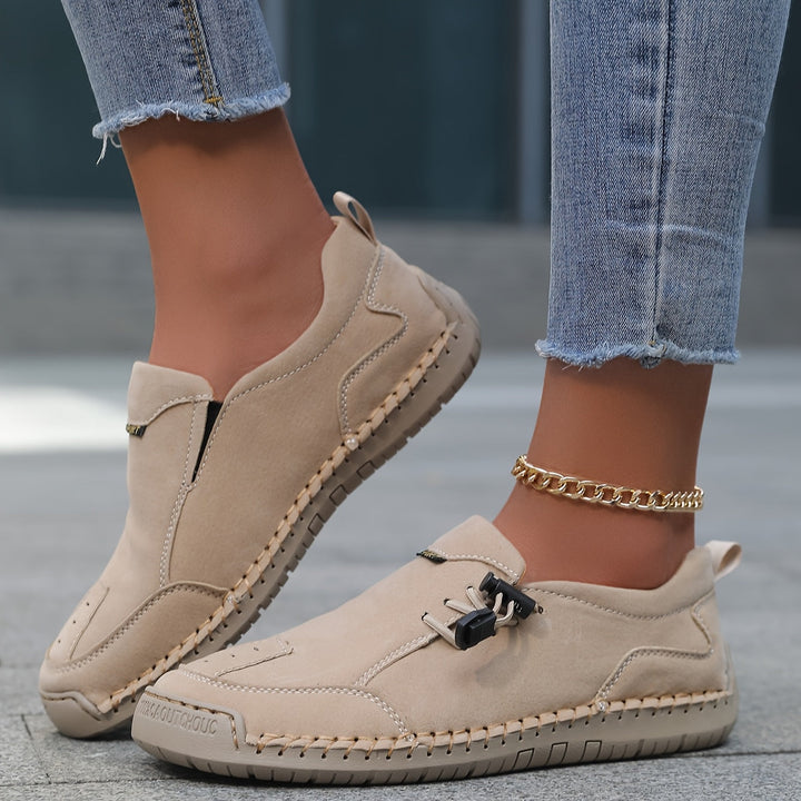 A woman walking smoothly in soft, supportive therapeutic walking shoes.