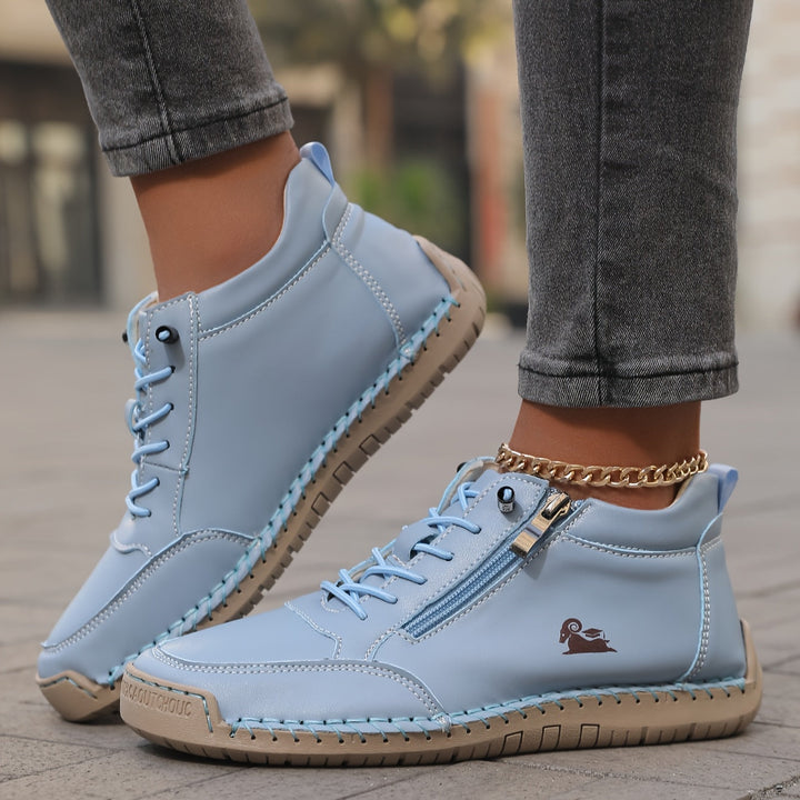 A woman standing comfortably in wide-fit therapeutic comfort shoes
