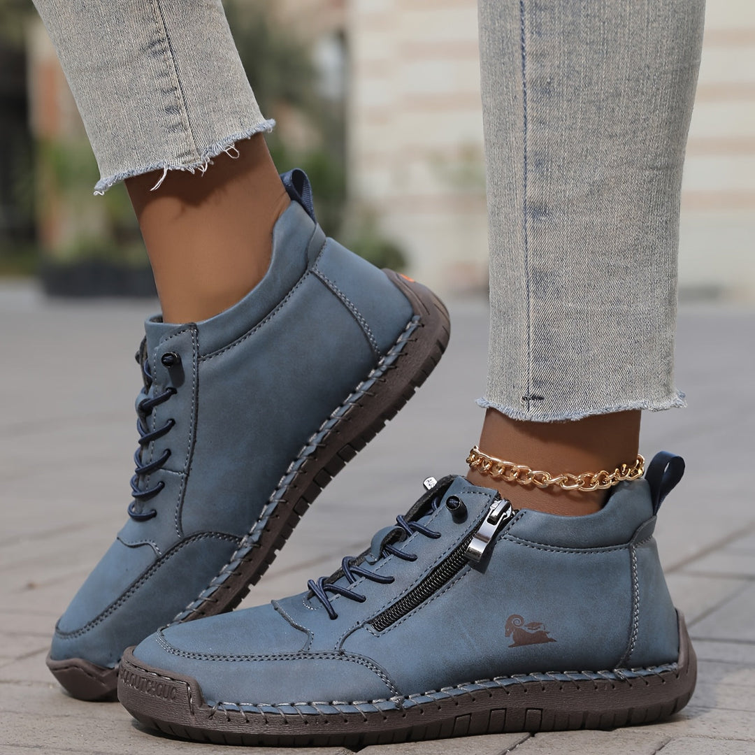 A woman standing comfortably in wide-fit therapeutic comfort shoes