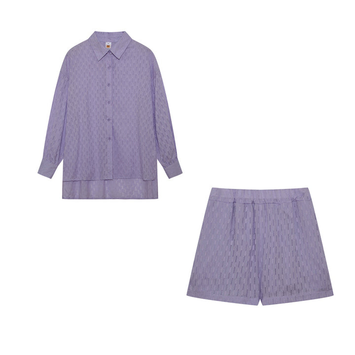 A woman wearing a classic button shirt with matching relaxed shorts, polished and easy.
