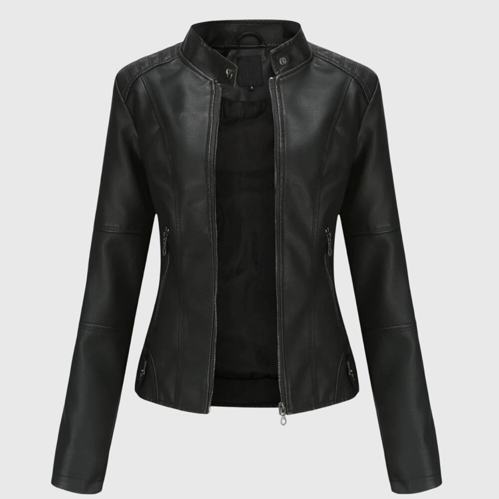 A woman wearing a fitted black moto jacket with a supple finish, styled for an evening out.
