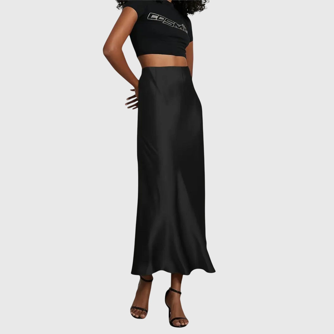 A woman in a fitted fishtail skirt with a flared hem, styled elegantly for a special occasion.