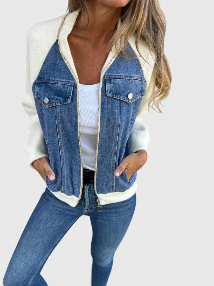 A woman wearing a V-neck zip jacket with a relaxed fit