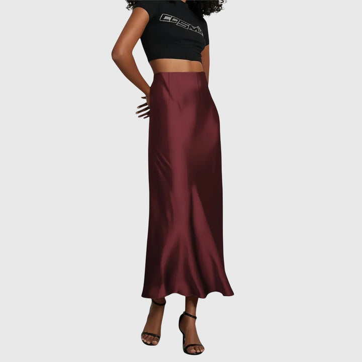 A woman in a fitted fishtail skirt with a flared hem, styled elegantly for a special occasion.