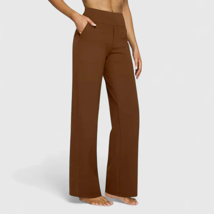 A woman in elegant straight-leg pants with pockets, styled for a polished everyday look.
