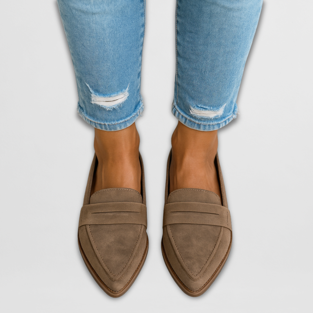 A woman wearing soft-touch loafers on a relaxed day out.