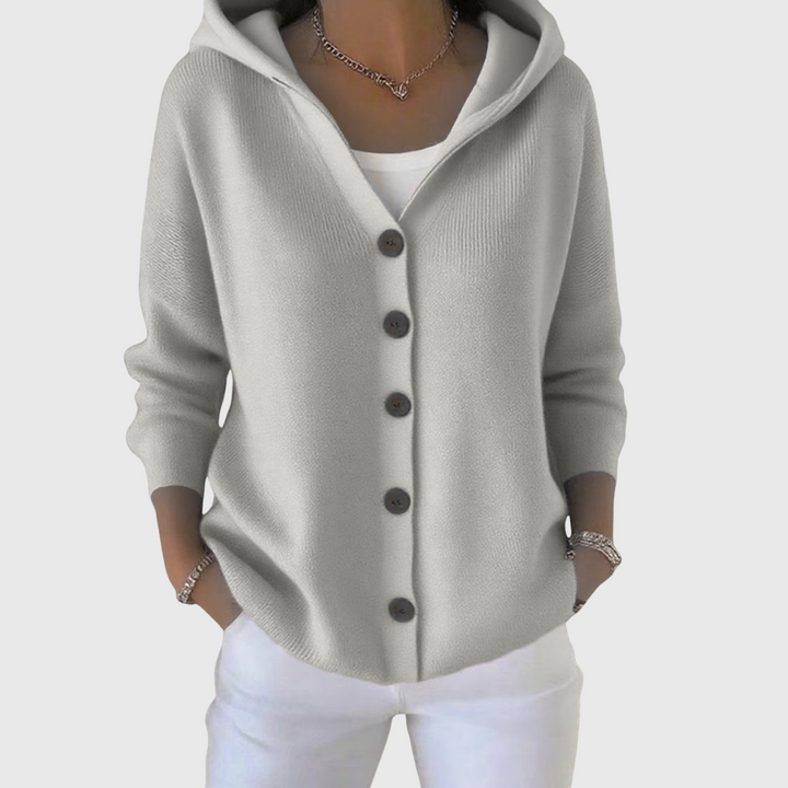 A woman wearing a hooded button cardigan open over a top for a relaxed everyday look.