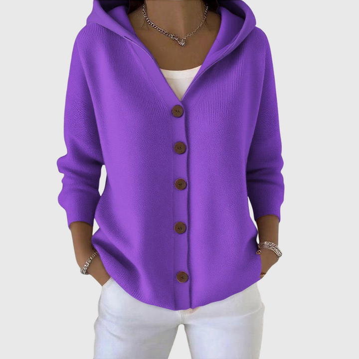A woman wearing a hooded button cardigan open over a top for a relaxed everyday look.