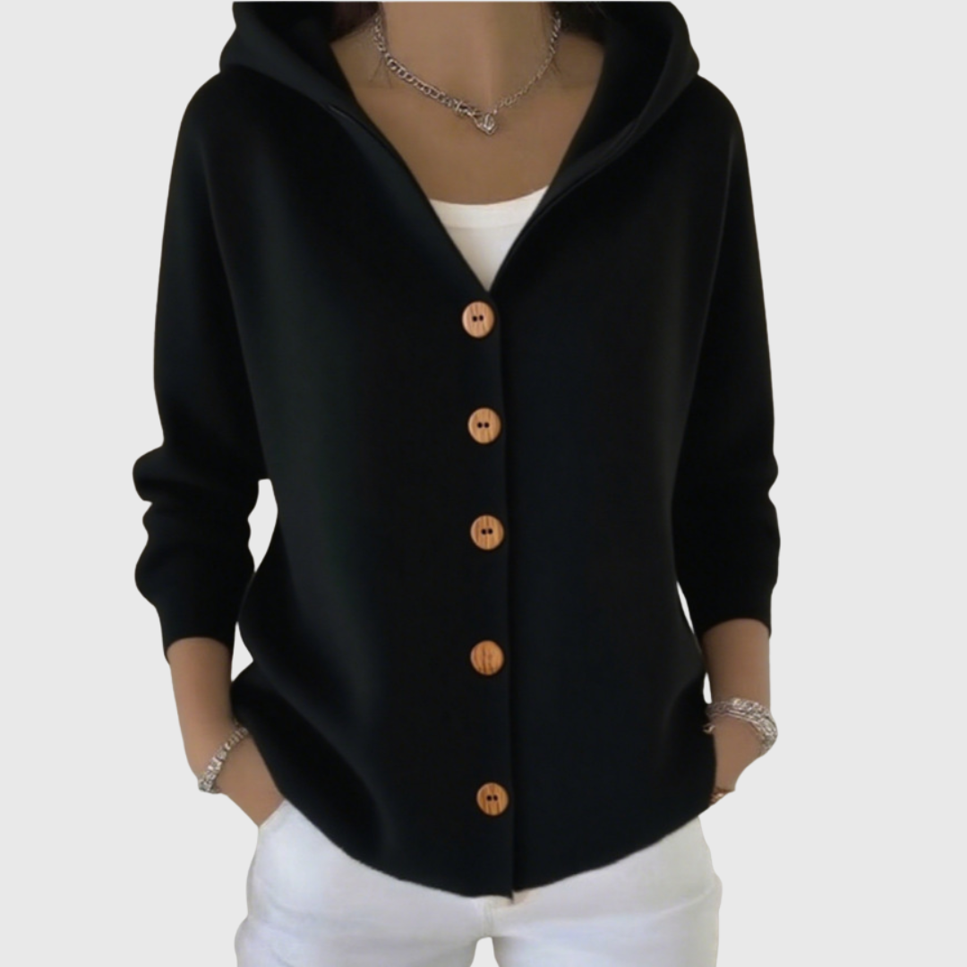 A woman wearing a hooded button cardigan open over a top for a relaxed everyday look.