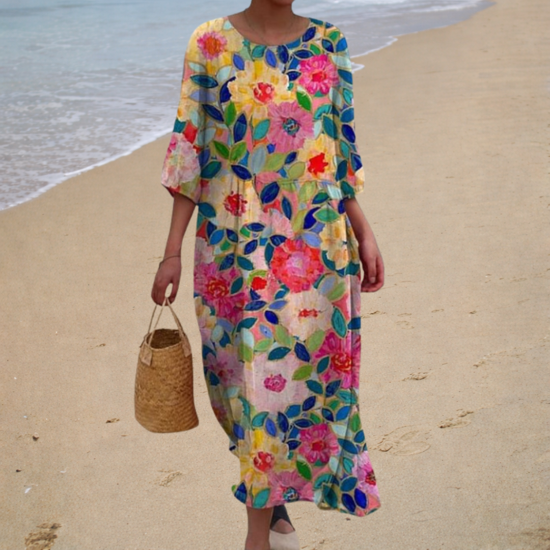A woman wearing a long flowing summer dress that sways gently as she walks in the sunshine.