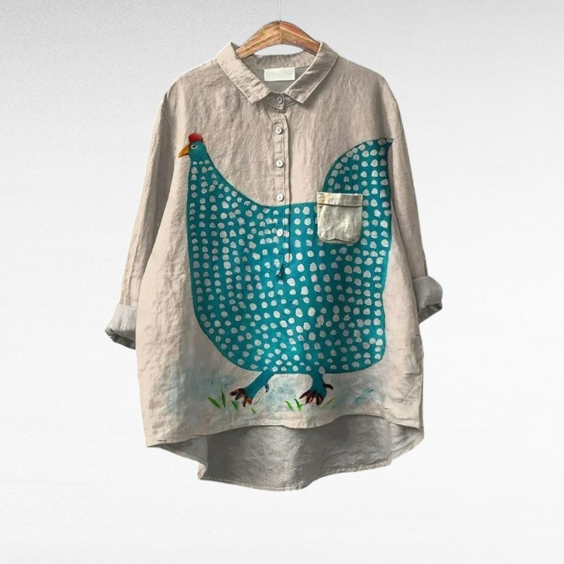 A woman wearing a light patterned summer blouse on a warm evening