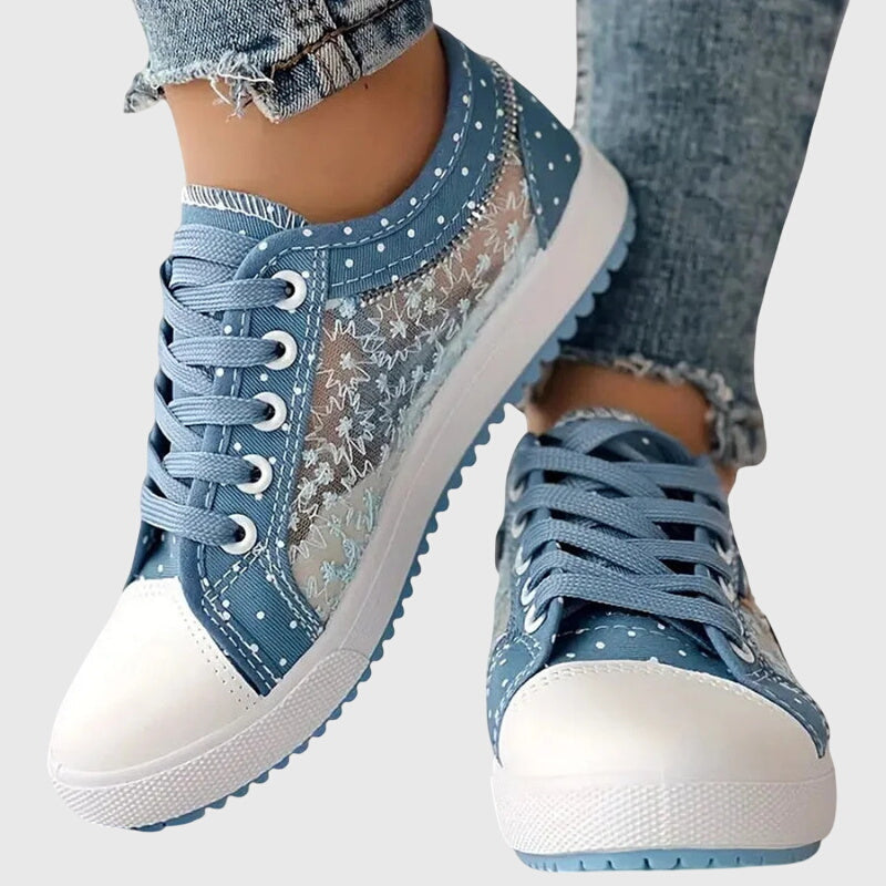 A woman walking comfortably in blue cushioned orthopaedic sneakers