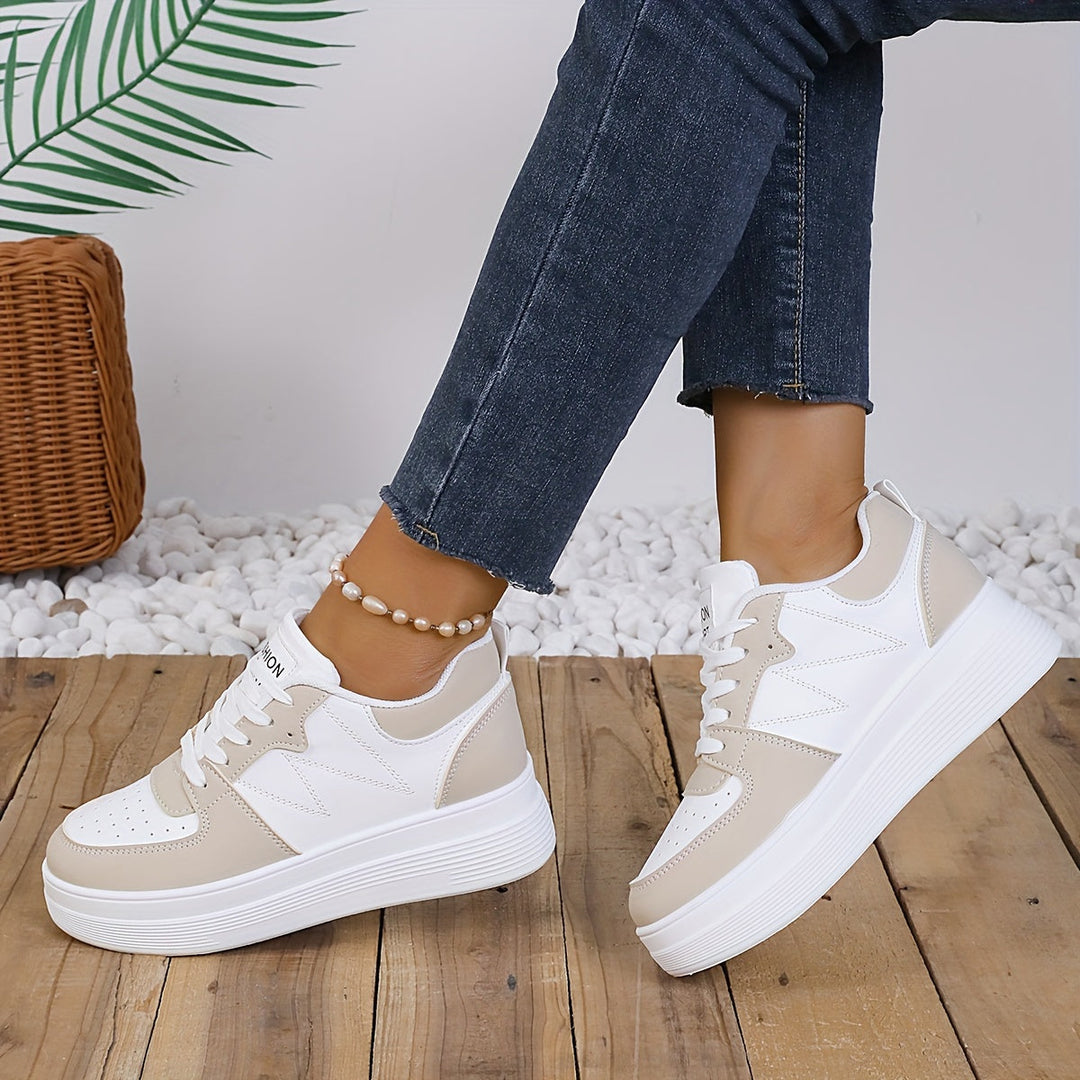 A woman wearing elegant two-tone platform sneakers in the city