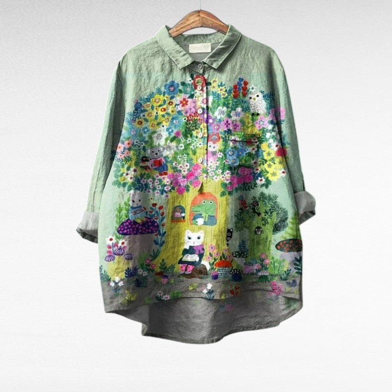 A woman wearing a light patterned summer blouse on a sunny day