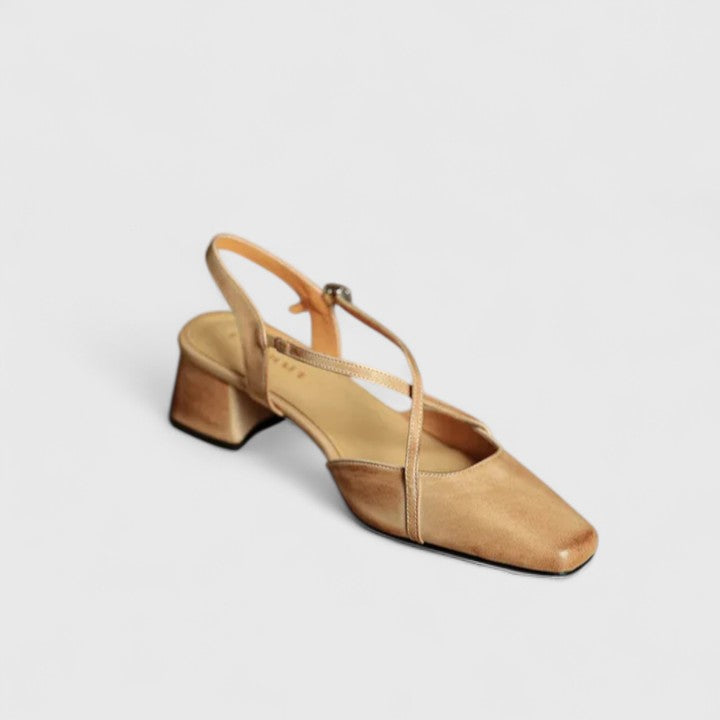 Burgundy closed square-toe flats with criss-cross instep straps and a buckled slingback.