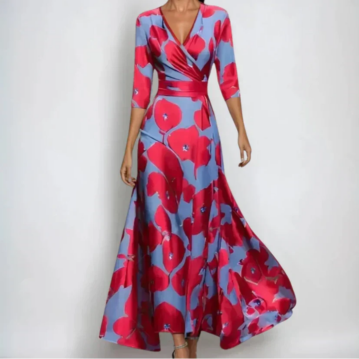Woman wearing the Donna floral midi dress with wrap neckline and flowing skirt at a celebration.
