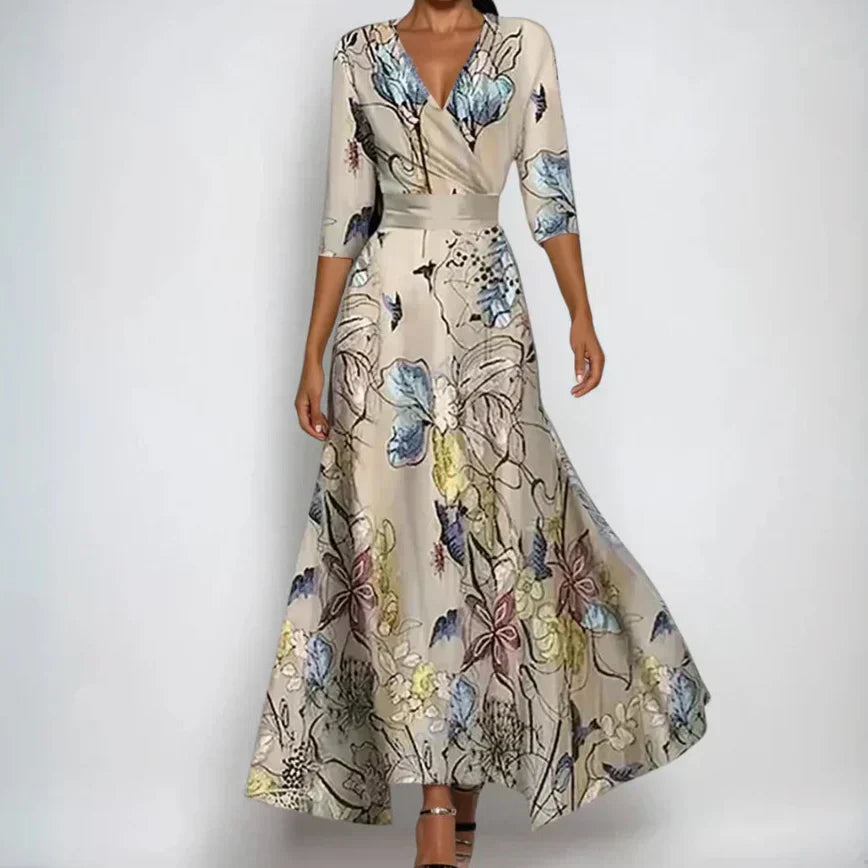 Woman wearing the Donna floral midi dress with wrap neckline and flowing skirt at a celebration.