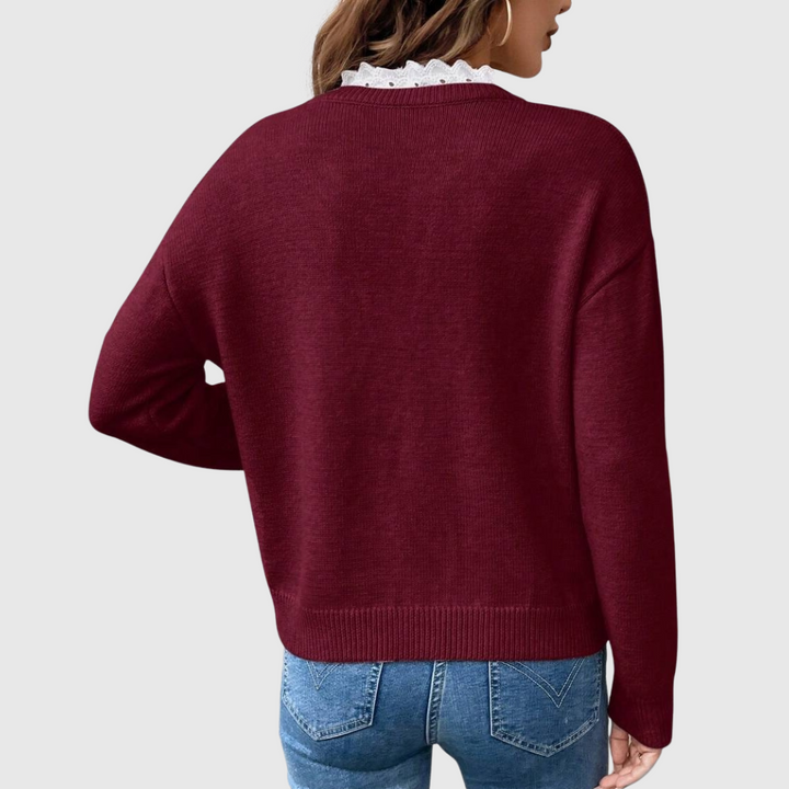 A woman wearing an elegant top with delicate detailing, flattering and comfortable for day to evening.