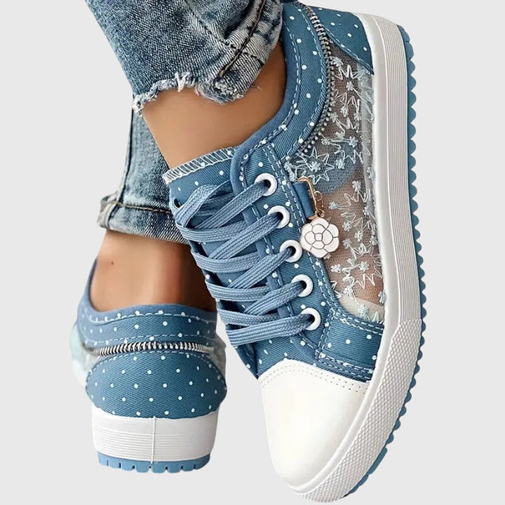 A woman walking comfortably in blue cushioned orthopaedic sneakers