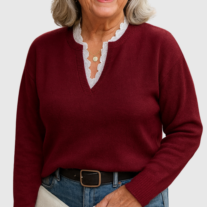 A woman wearing an elegant top with delicate detailing, flattering and comfortable for day to evening.