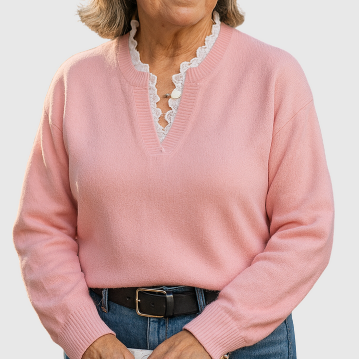 A woman wearing an elegant top with delicate detailing, flattering and comfortable for day to evening.