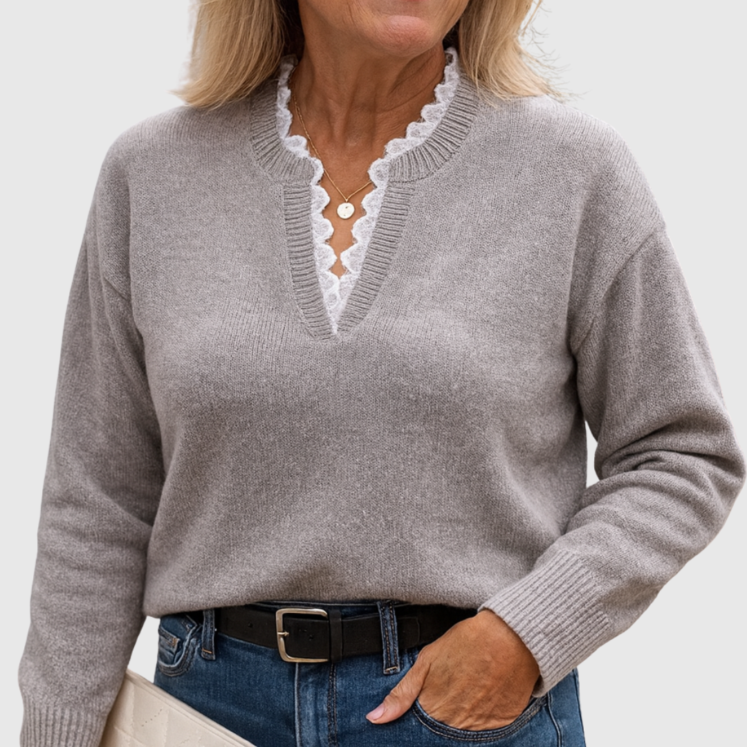 A woman wearing an elegant top with delicate detailing, flattering and comfortable for day to evening.