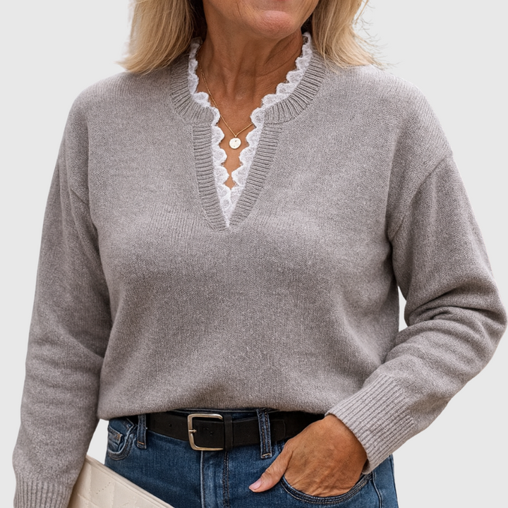 A woman wearing an elegant top with delicate detailing, flattering and comfortable for day to evening.