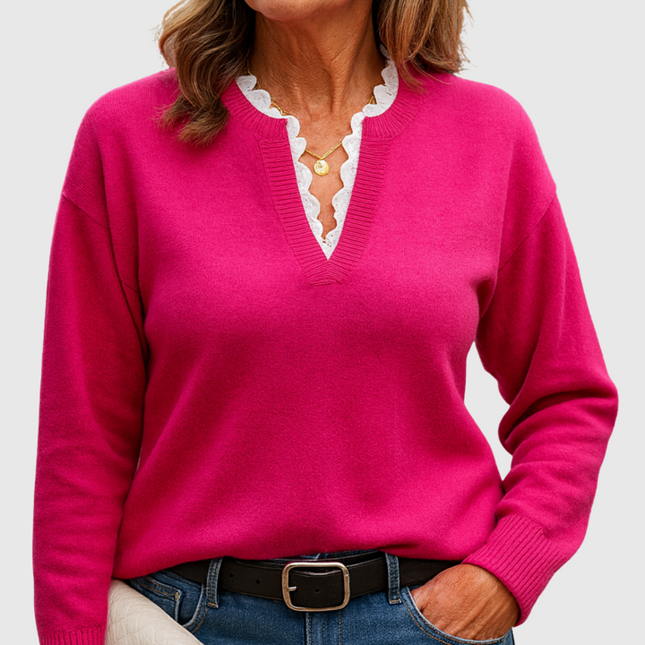 A woman wearing an elegant top with delicate detailing, flattering and comfortable for day to evening.
