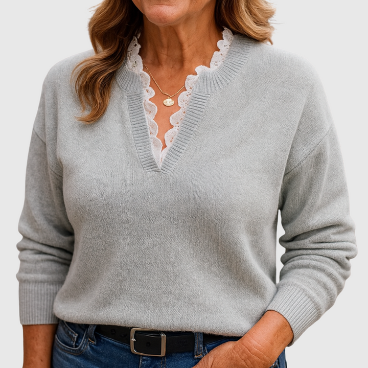 A woman wearing an elegant top with delicate detailing, flattering and comfortable for day to evening.