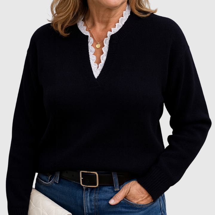 A woman wearing an elegant top with delicate detailing, flattering and comfortable for day to evening.
