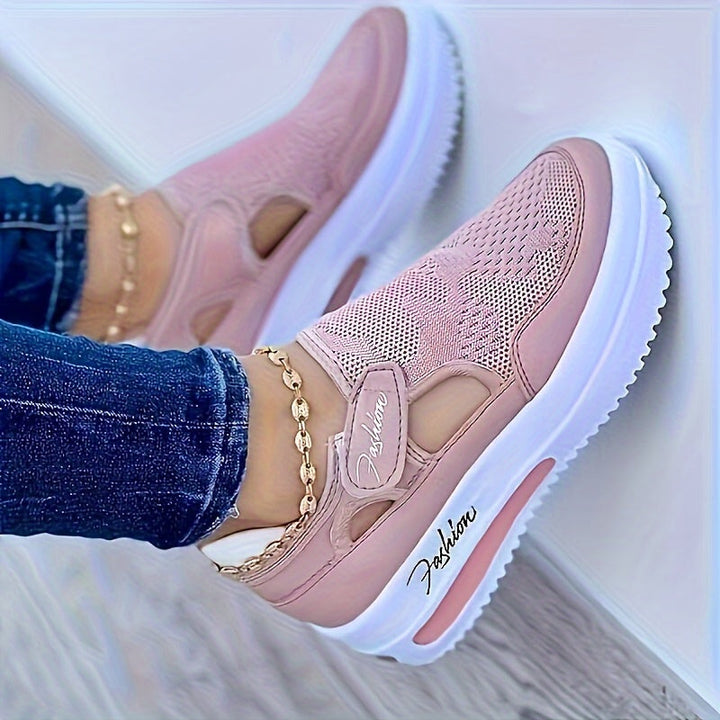 A woman slipping on breathable, cushioned slip-on sneakers with pants