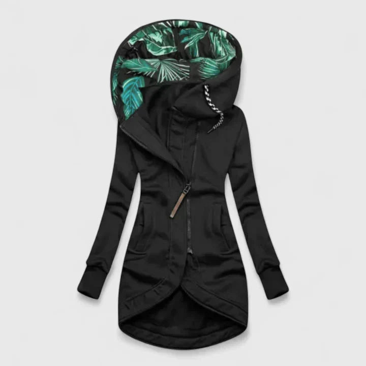 A navy hooded zip-up jacket with a leaf-print hood lining and a longer curved hem
