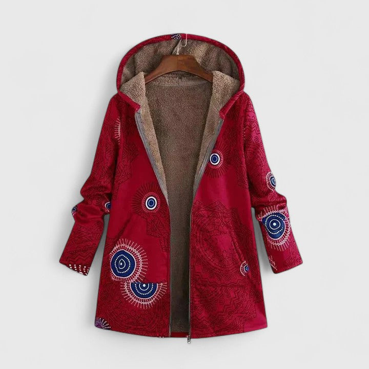 A woman wearing a geometric-print boho jacket, warmly layered on a winter day out.