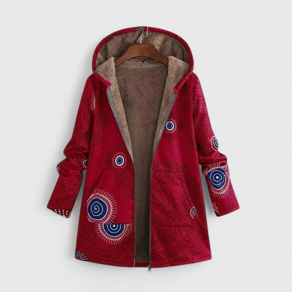 A woman wearing a geometric-print boho jacket, warmly layered on a winter day out.