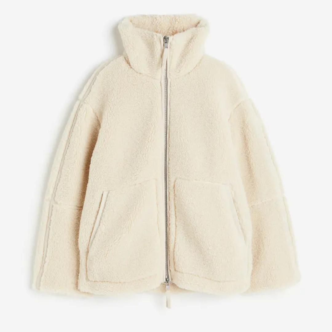 A soft, textured winter jacket with a tall stand collar, zip front and patch pockets