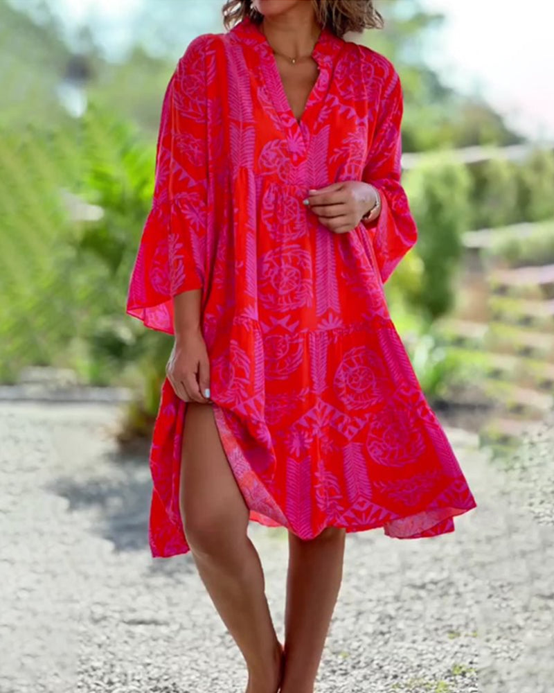 Woman in a loose boho print midi dress enjoying a relaxed day outdoors.