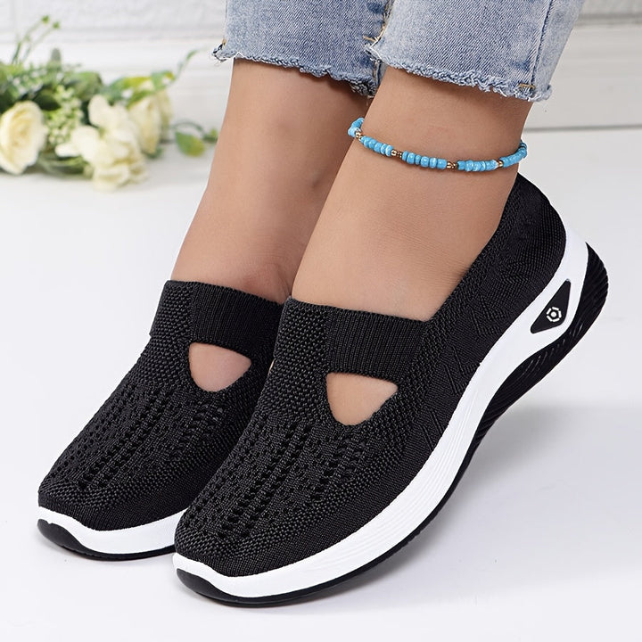 A woman stepping into easy slip-on comfort sneakers with no laces.