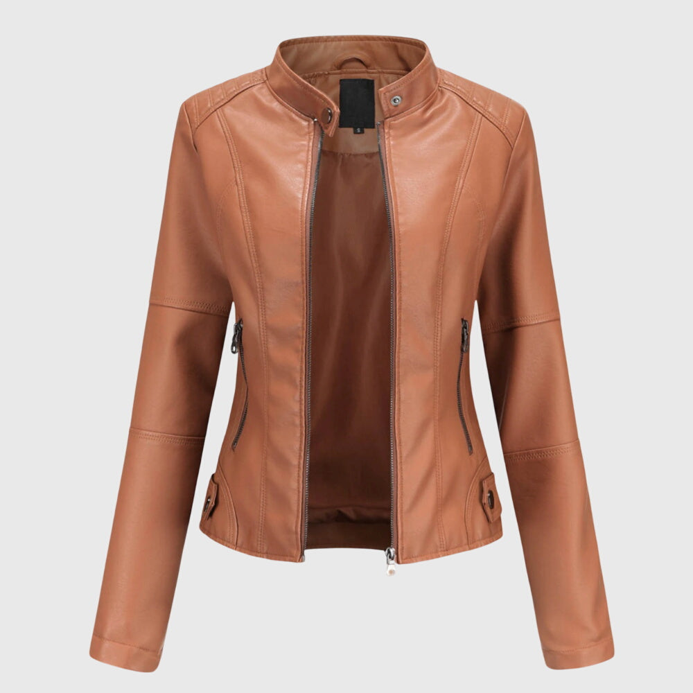 A woman wearing a fitted black moto jacket with a supple finish, styled for an evening out.