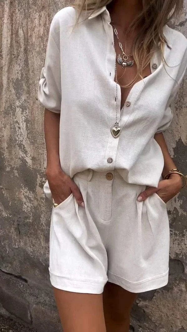 A woman in a coordinated button top and shorts set, styled for an easy sunny summer look.