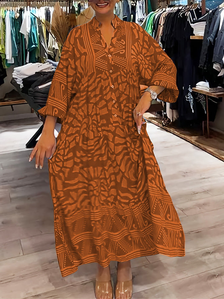 Woman wearing the Gina™ vivid printed maxi dress with a button front, standing confidently outdoors.