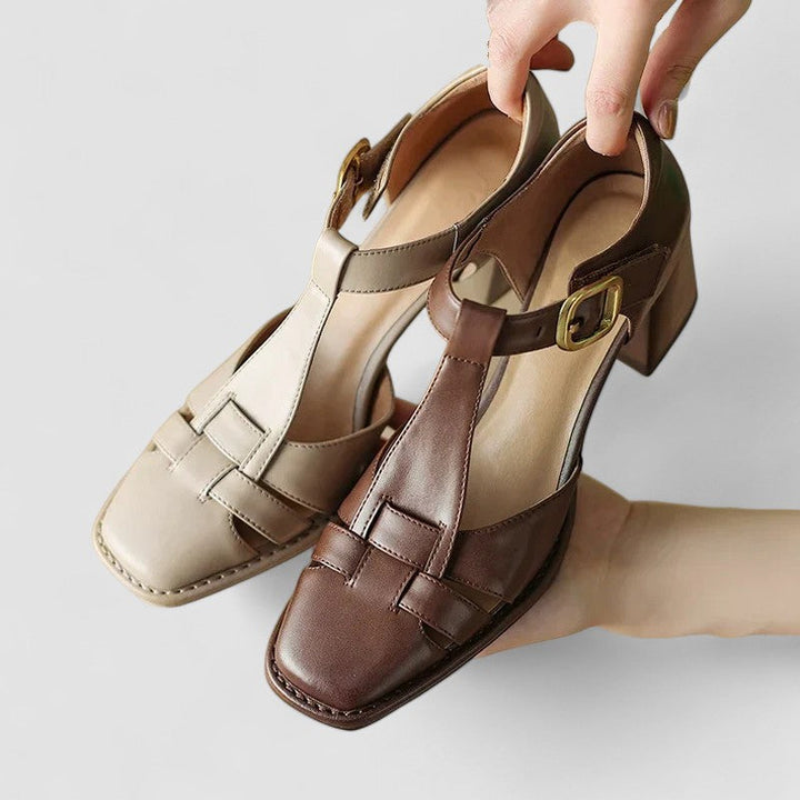 A woman in brown T-strap block heel shoes with a square toe, steady and comfortable during a day out.