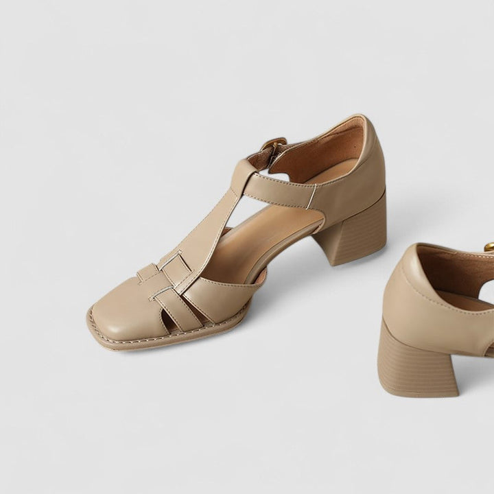 A woman in brown T-strap block heel shoes with a square toe, steady and comfortable during a day out.