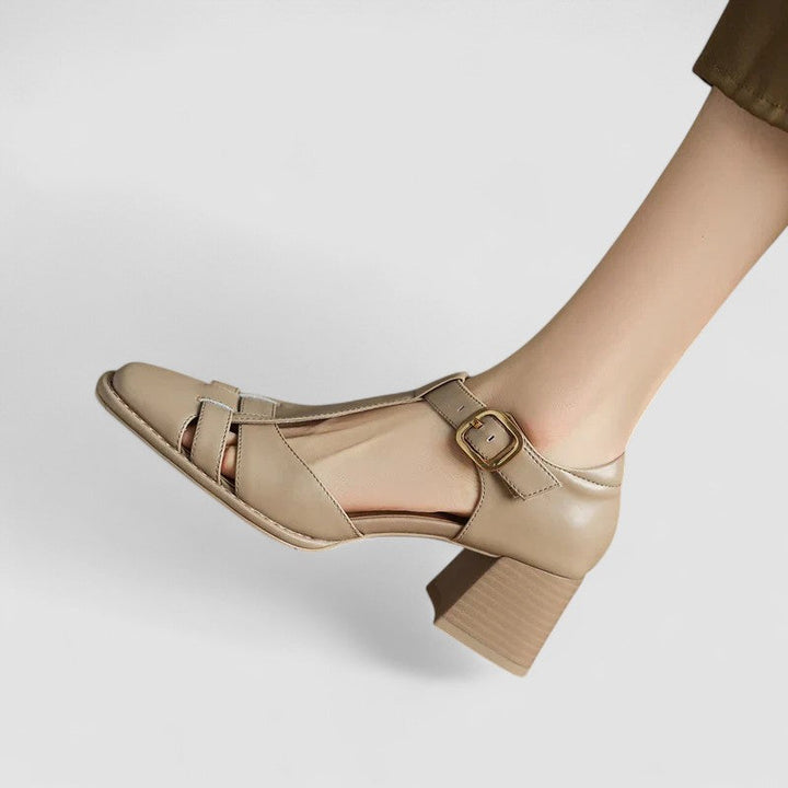 A woman in brown T-strap block heel shoes with a square toe, steady and comfortable during a day out.