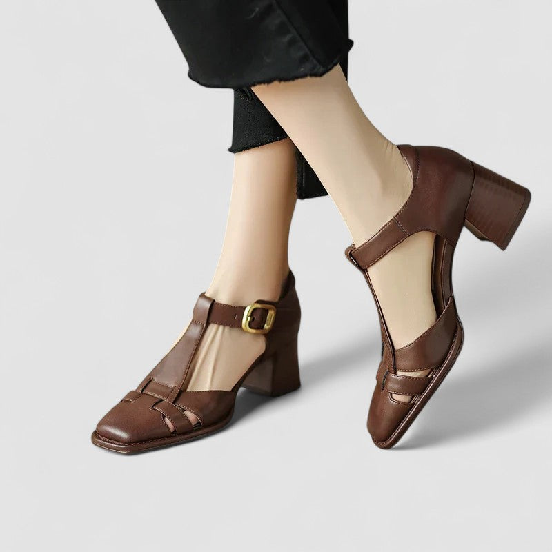 A woman in brown T-strap block heel shoes with a square toe, steady and comfortable during a day out.
