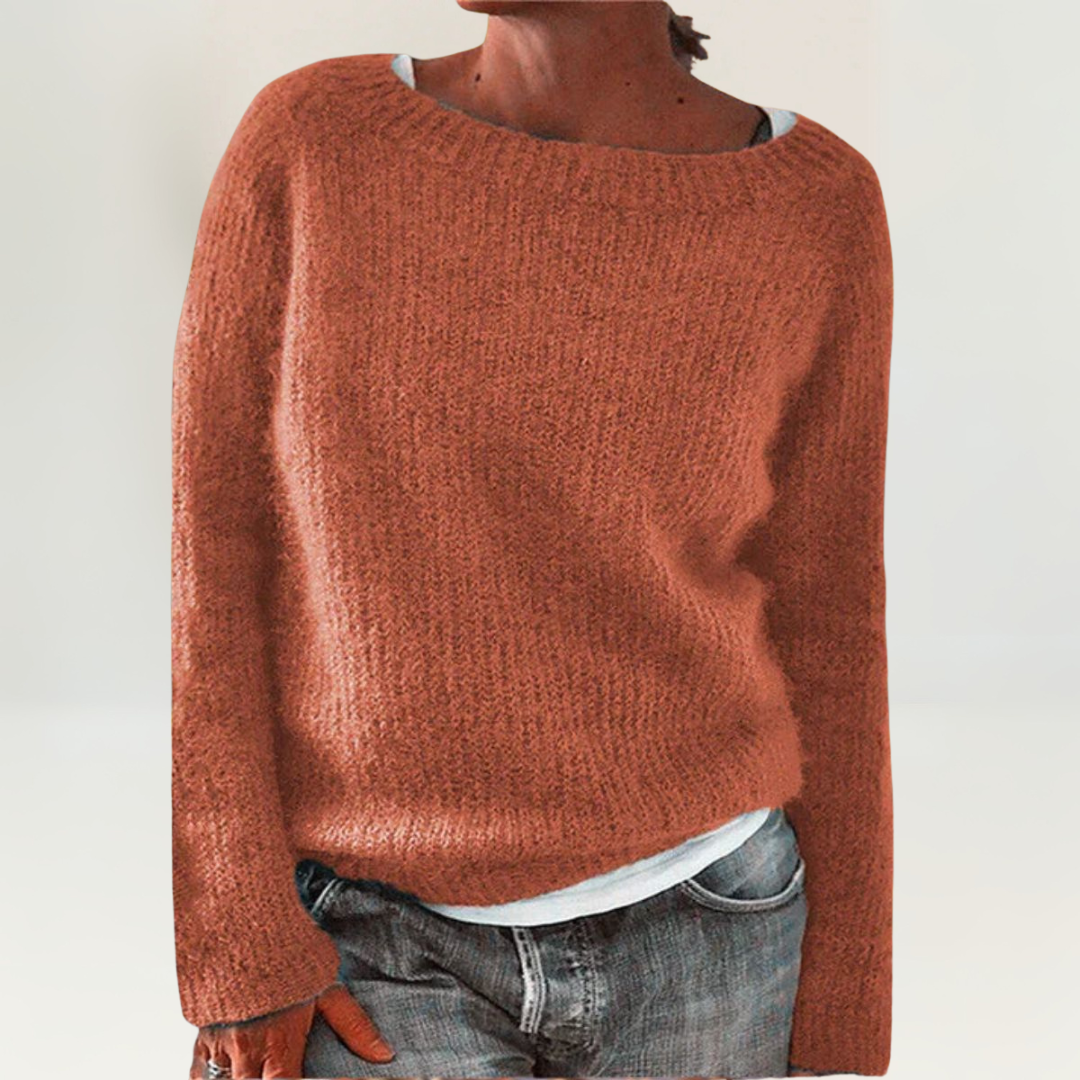 A woman wearing a soft, relaxed everyday sweater, comfortable and elegant with jeans.
