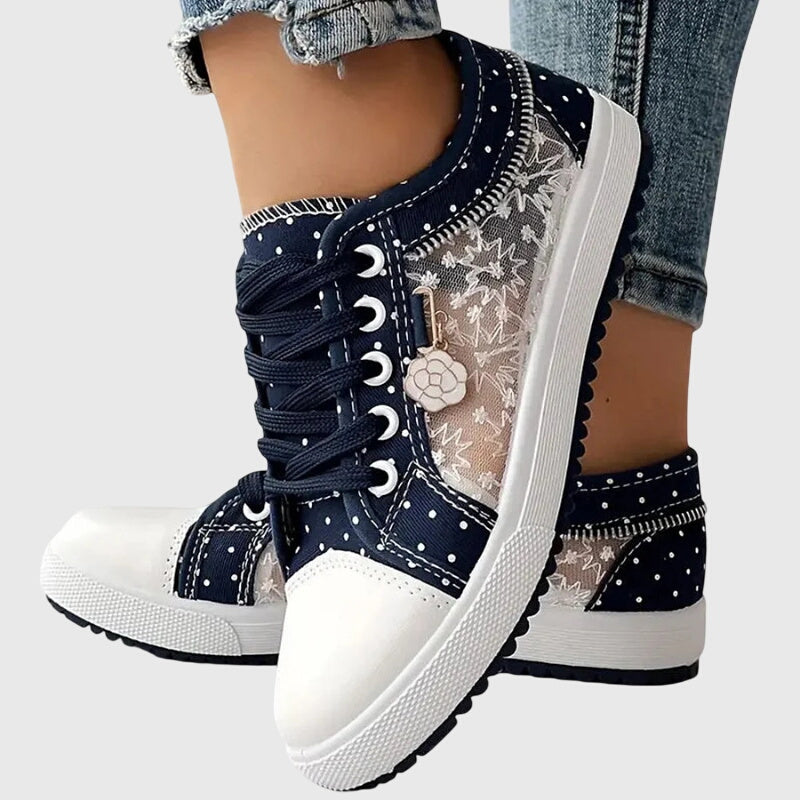 A woman walking comfortably in blue cushioned orthopaedic sneakers