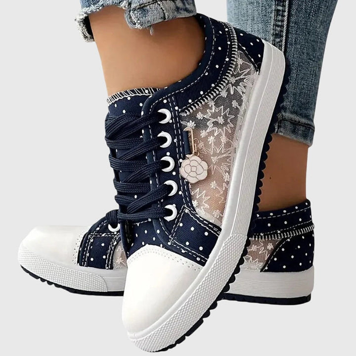 A woman walking comfortably in blue cushioned orthopaedic sneakers