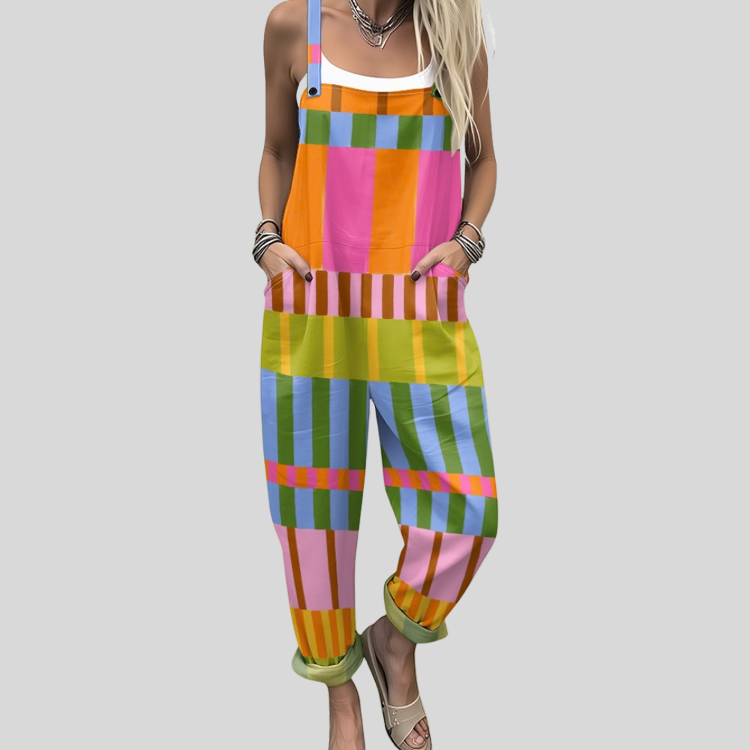 Woman wearing bright overalls in a colourful crossing check of pink, blue, orange, green and yellow.