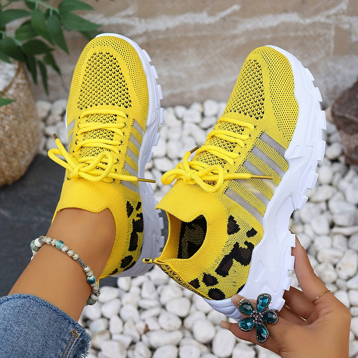 A woman walking in light, breathable comfort sneakers on a warm day.